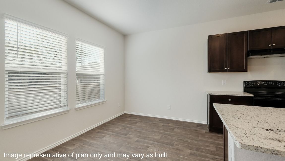 DR Horton Von Ormy Preserve at Medina the emma floor plan 1700 square feet dining area with hard surface flooring and large windows for natural light