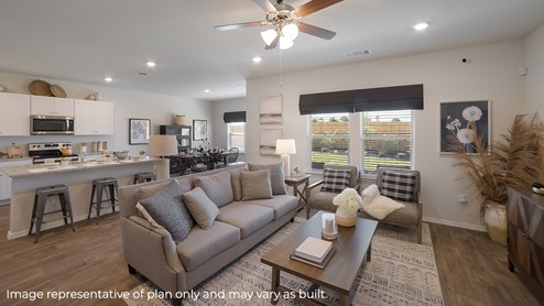 DR Horton Von Ormy Preserve at Medina the nicole floor plan 2473 square feet 2 story 2 car garage open concept living room with hard surface flooring flowing to kitchen and dining area