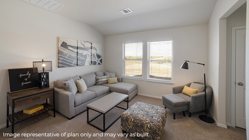 DR Horton Von Ormy Preserve at Medina the nicole floor plan 2473 square feet upstairs loft with carpet flooring large windows couch ottoman armchair and coffee table