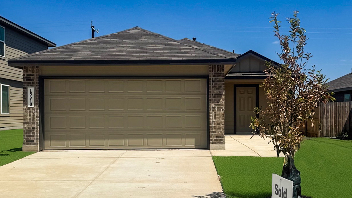 Front exterior of home with two car garage.