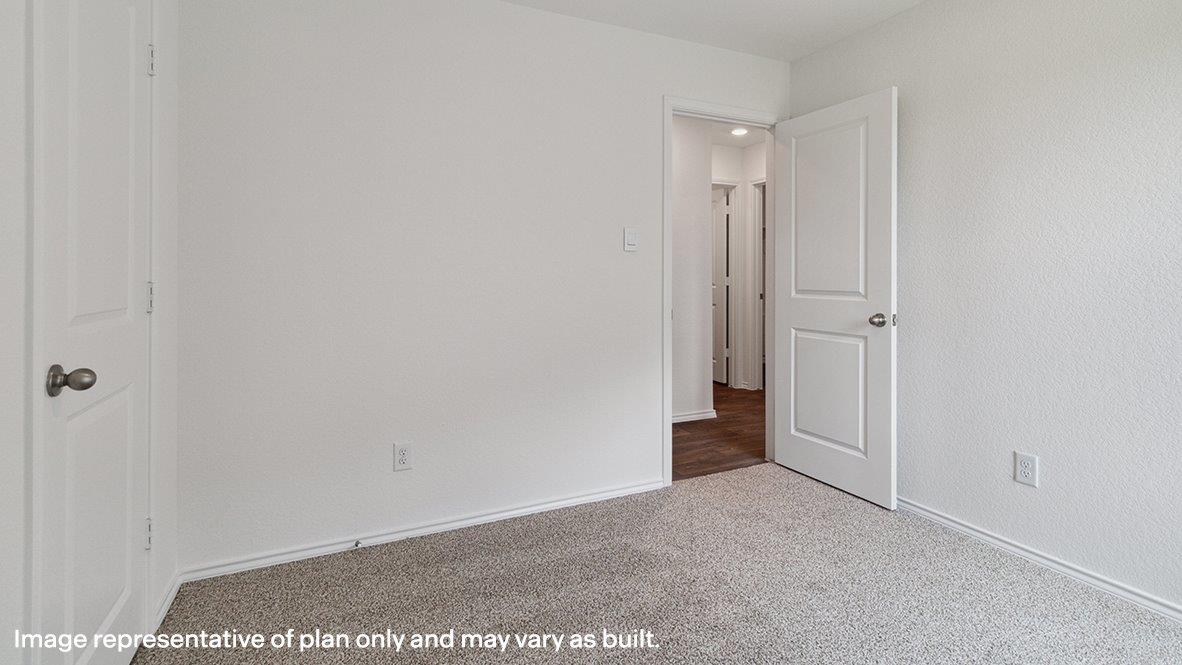 Bedroom with carpeted floors.