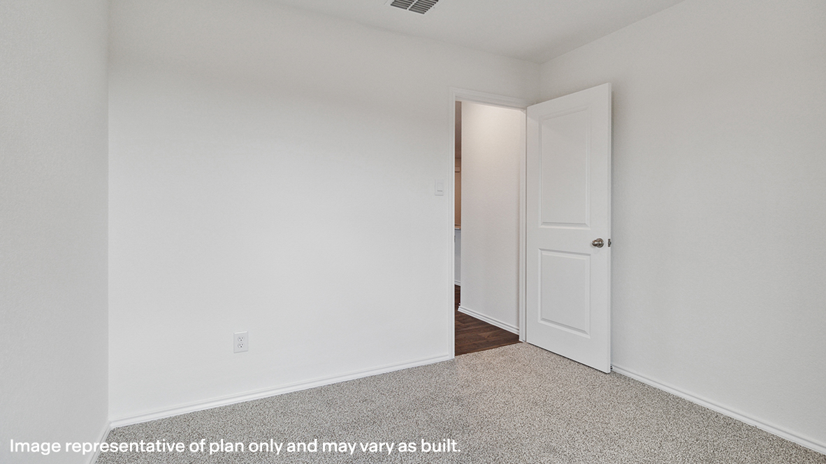 Bedroom with carpeted floors.