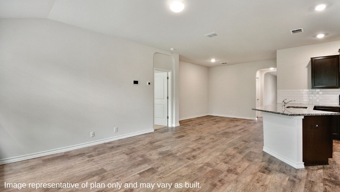Spacious kitchen with brand new stainless steel appliances connecting to the living area.