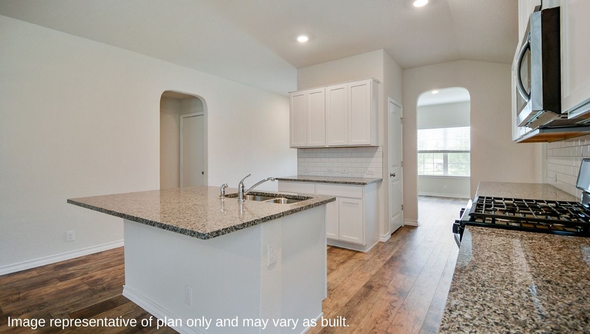 Kitchen featuring brand new stainless steel appliances, cabinets, and a large island.