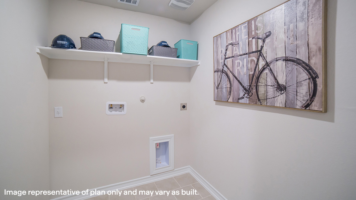 Laundry room with shelving above appliance hook ups.