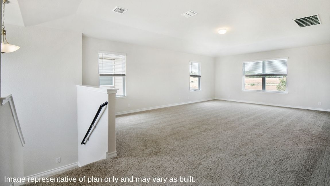 Simple upper floor landing with neutral tones and natural light.