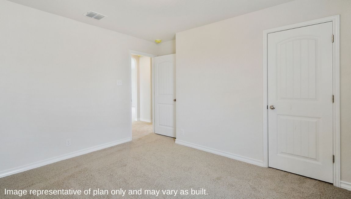Bedroom with neutral walls, closet space, and natural lighting.