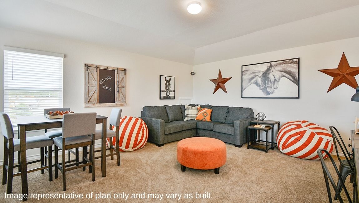Large loft area with carpet and natural light.