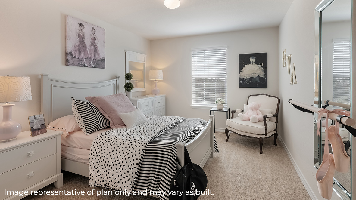 Bedroom with neutral walls, furnishings, and a window.