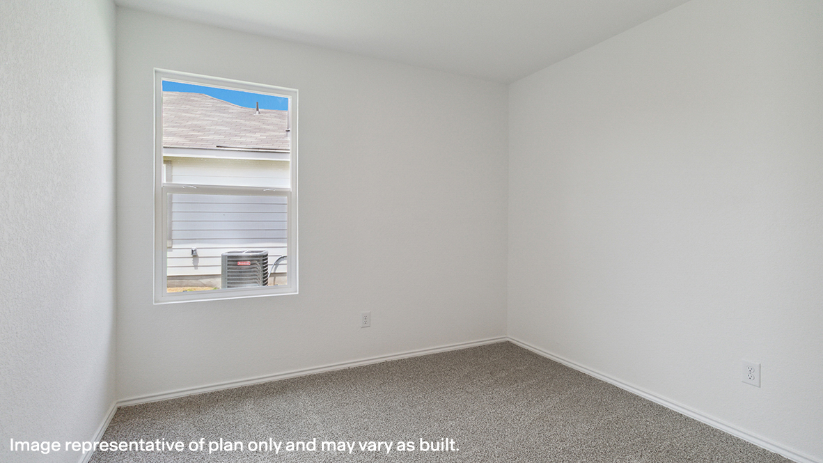 Bedroom with carpeted floors and a window.