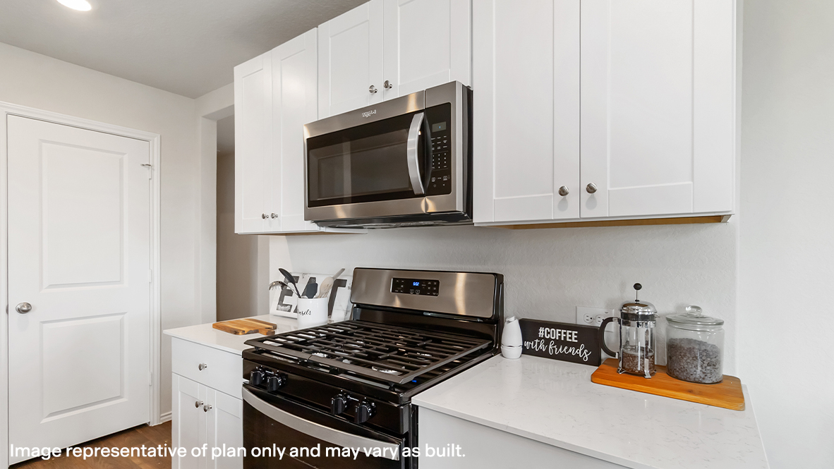 Kitchen with white cabinetry.