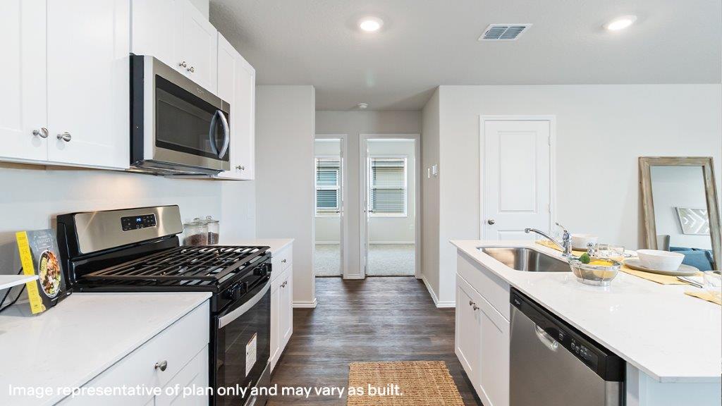 Kitchen with stainless steel appliances.