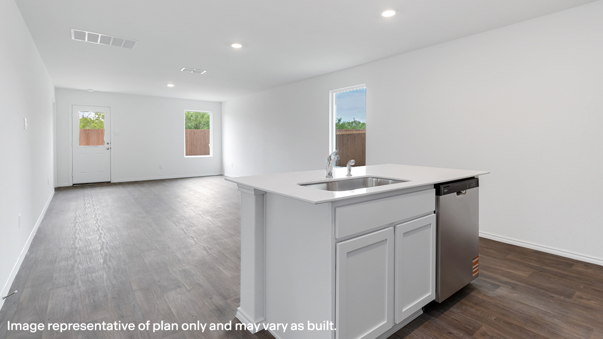 Kitchen with open view of living room.