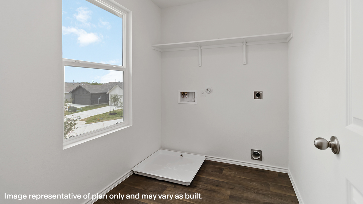 Laundry room with built in shelving.