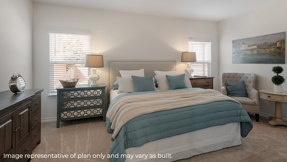 Spacious primary bedroom located off family room with ensuite bathroom.