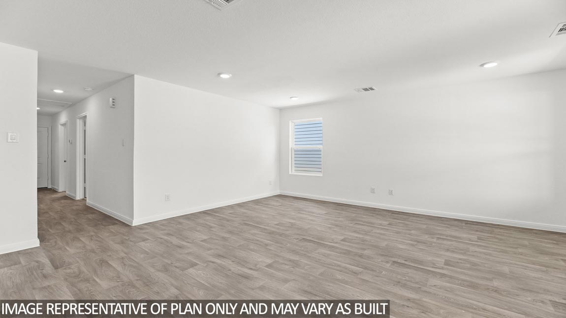 Spacious living room looking toward modern kitchen island, dining, new appliance suite included Sonora