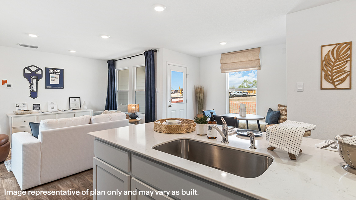 View from kitchen into the living room, backyard, showing fresh open designs at Sonora