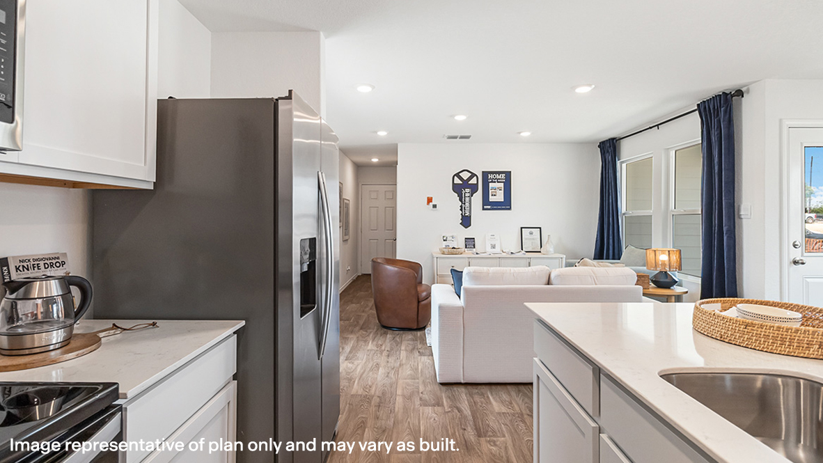View from kitchen into the living room, backyard area, showing fresh open design at Sonora
