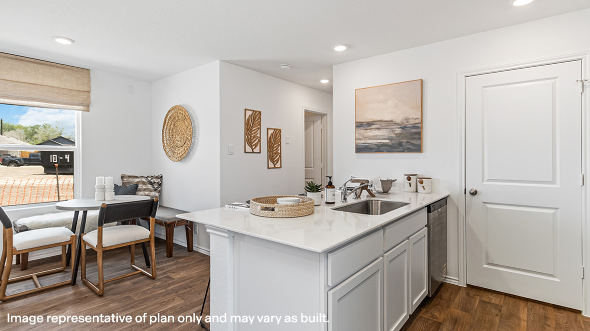 Spacious living room with view into dining and kitchen areas, and outside access at Sonora