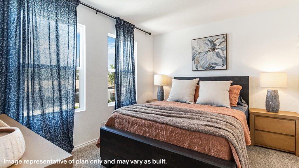 Owner’s suite offers natural window light, spa-inspired ensuite bathroom, backyard view, walk-in closet for everyday style