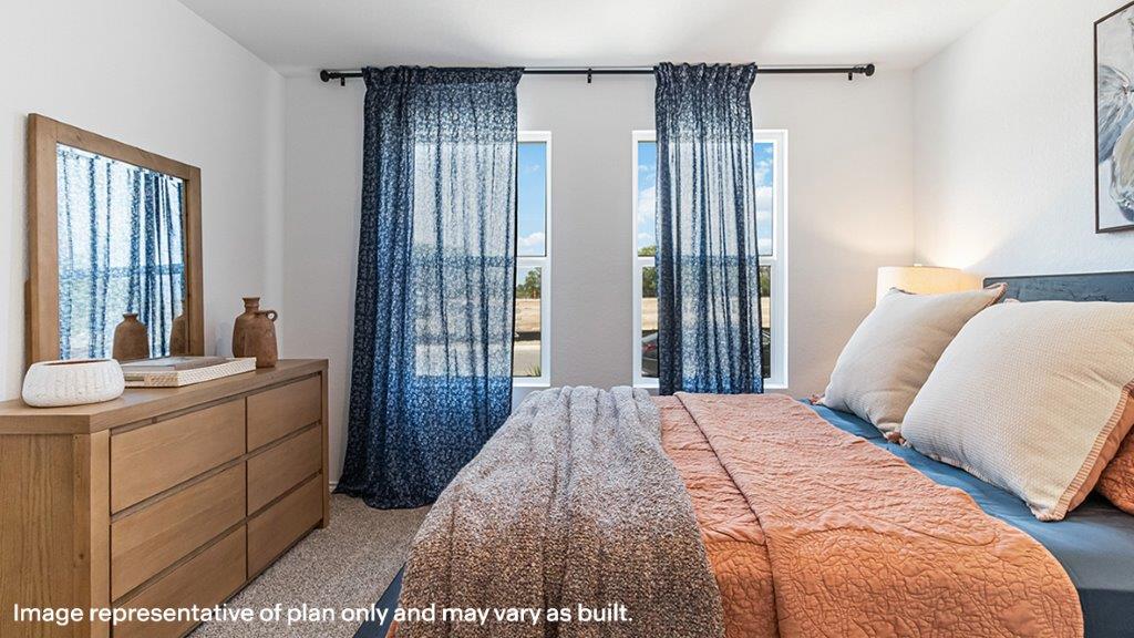 Primary bedroom designed with privacy and space in mind with a flow into a spa-inspired ensuite bathroom and walk-in closet