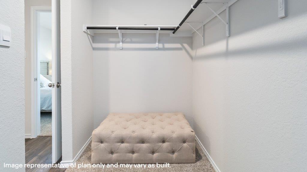 Owner’s suite walk-in closet with shelving and hanging space at Sereno Springs