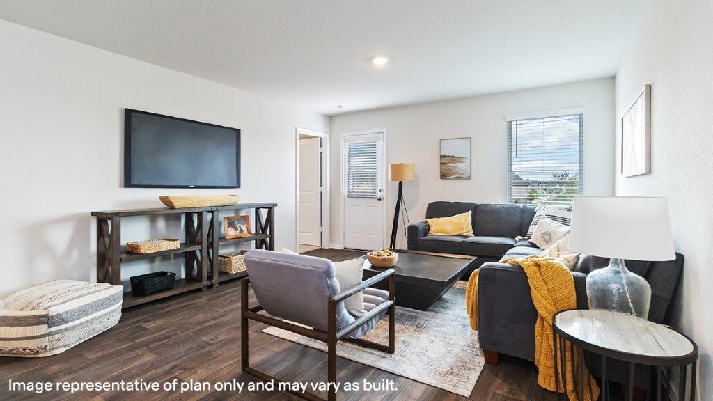 Living room alternate view with open layout to kitchen and dining at Sereno Springs