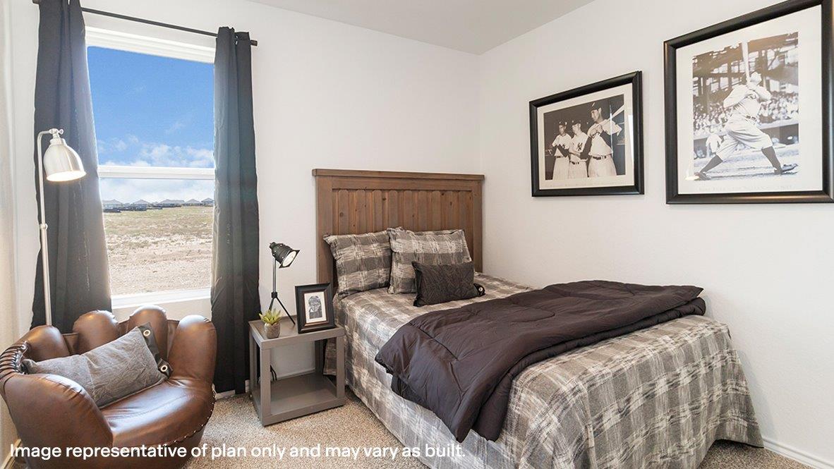 Secondary bedroom in Sereno Springs showcases soft carpet, a single closet, soft window light, multi-use potential