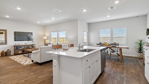 Hacienda Model Spacious, open-concept kitchen with island, shaker style cabinets and granite or quartz countertops.