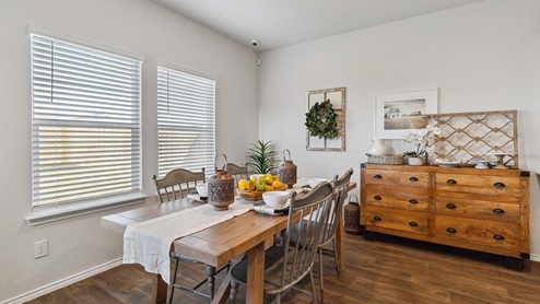 Hacienda Model Open-concept dining area with hard surface flooring.