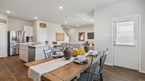 Hacienda Model Open-concept dining area with hard surface flooring.
