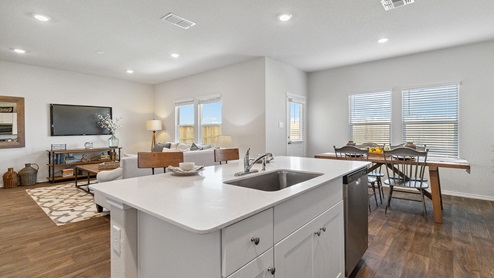 Hacienda Model Spacious kitchen with stainless steel appliances and hard surface flooring.
