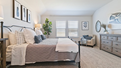Hacienda Model Spacious primary bedroom with quality carpet and ensuite bathroom.
