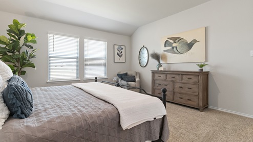 Hacienda Model Secondary bedroom with carpet, closet and window.