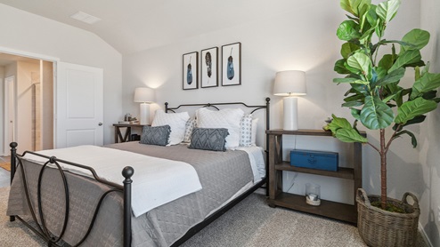 Hacienda Model Spacious primary bedroom with quality carpet and ensuite bathroom.