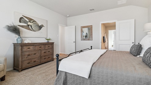 Hacienda Model Secondary bedroom with carpet, closet and window.