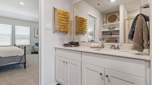 Hacienda Model Primary bathroom with walk-in shower and closet.
