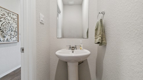 Hacienda Model Powder bath off of entry way.