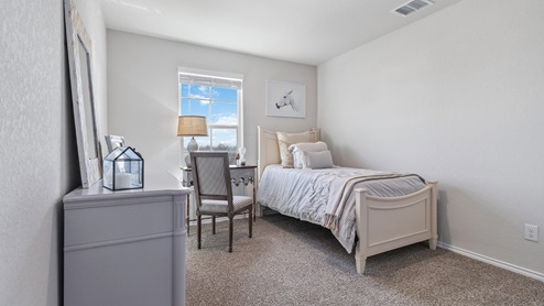 Hacienda Model Third bedroom with carpet, window and closet.