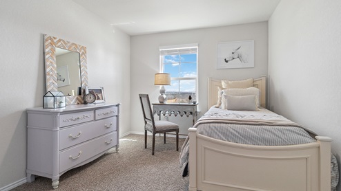 Hacienda Model Third bedroom with carpet, window and closet.
