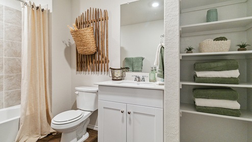 Hacienda Model Full bathroom at the top of the stairs.