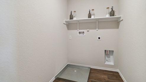 Hacienda Model Spacious utility room with shelving.