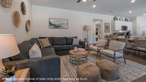 Spacious living area overlooking dining area and kitchen.