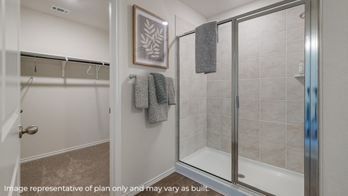 Primary bathroom with walk-in shower and closet.