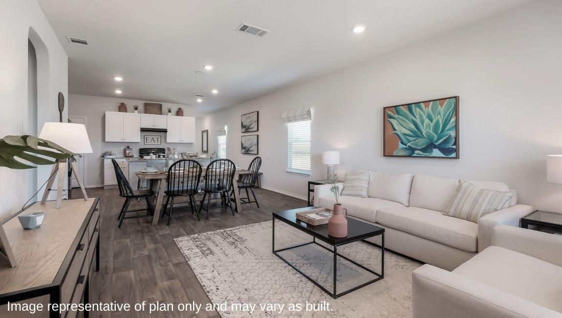 Spacious living area overlooking dining area and kitchen.