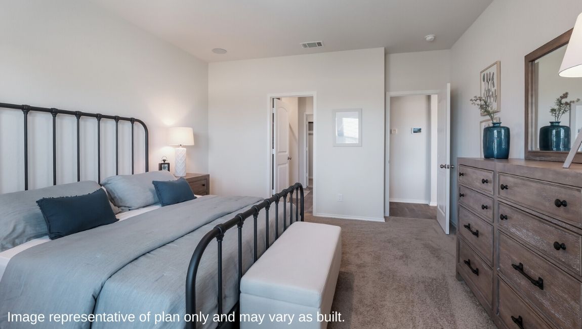 Spacious primary bedroom with ensuite bathroom and quality carpet.