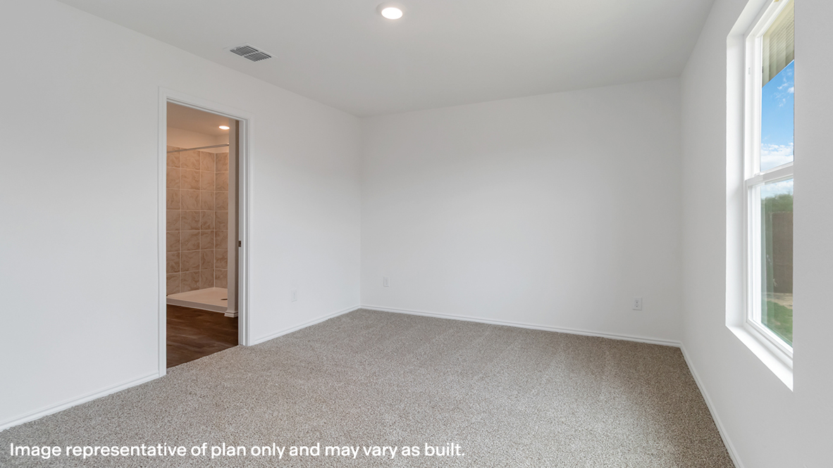 bedroom with beige carpet, white walls and a window