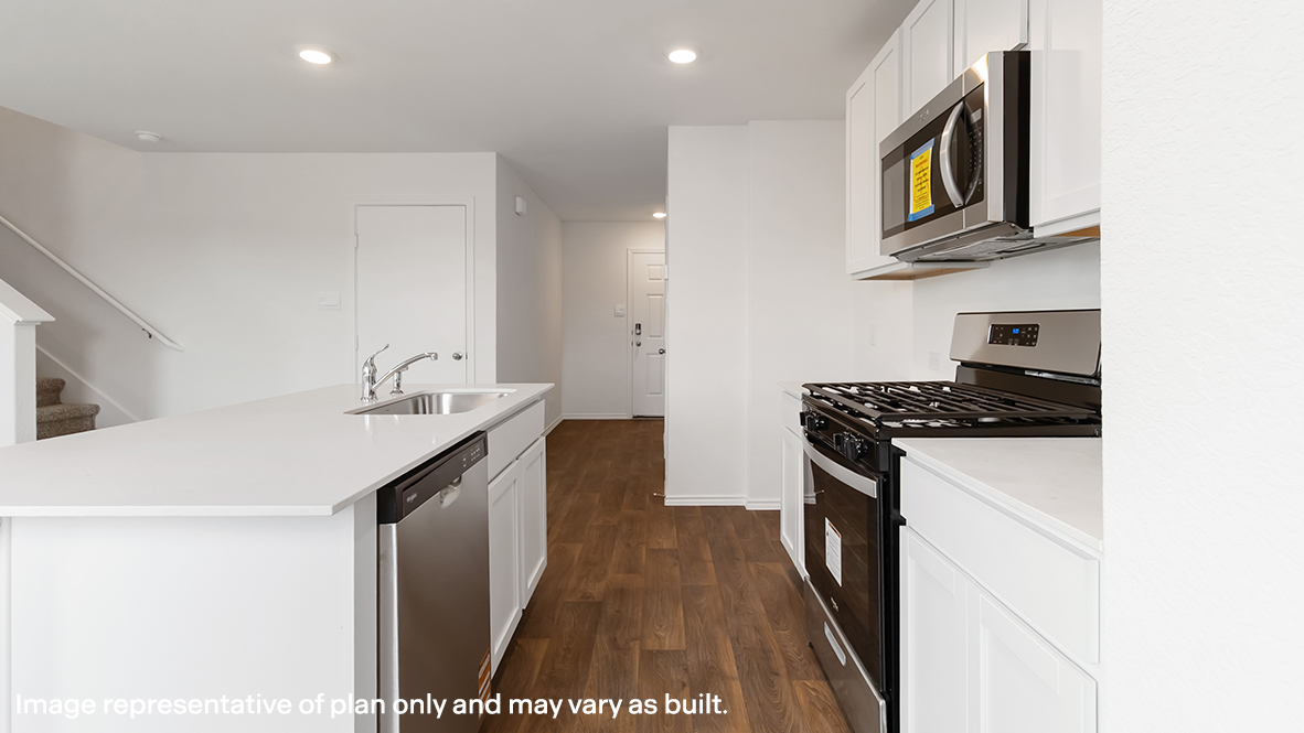 kitchen with white cabinetry, large island, and stainless steel appliances