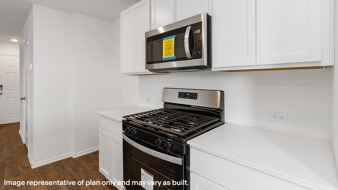 kitchen with white cabinetry, large island, and stainless steel appliances