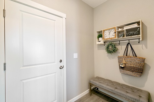 Entry way with a bench and decor